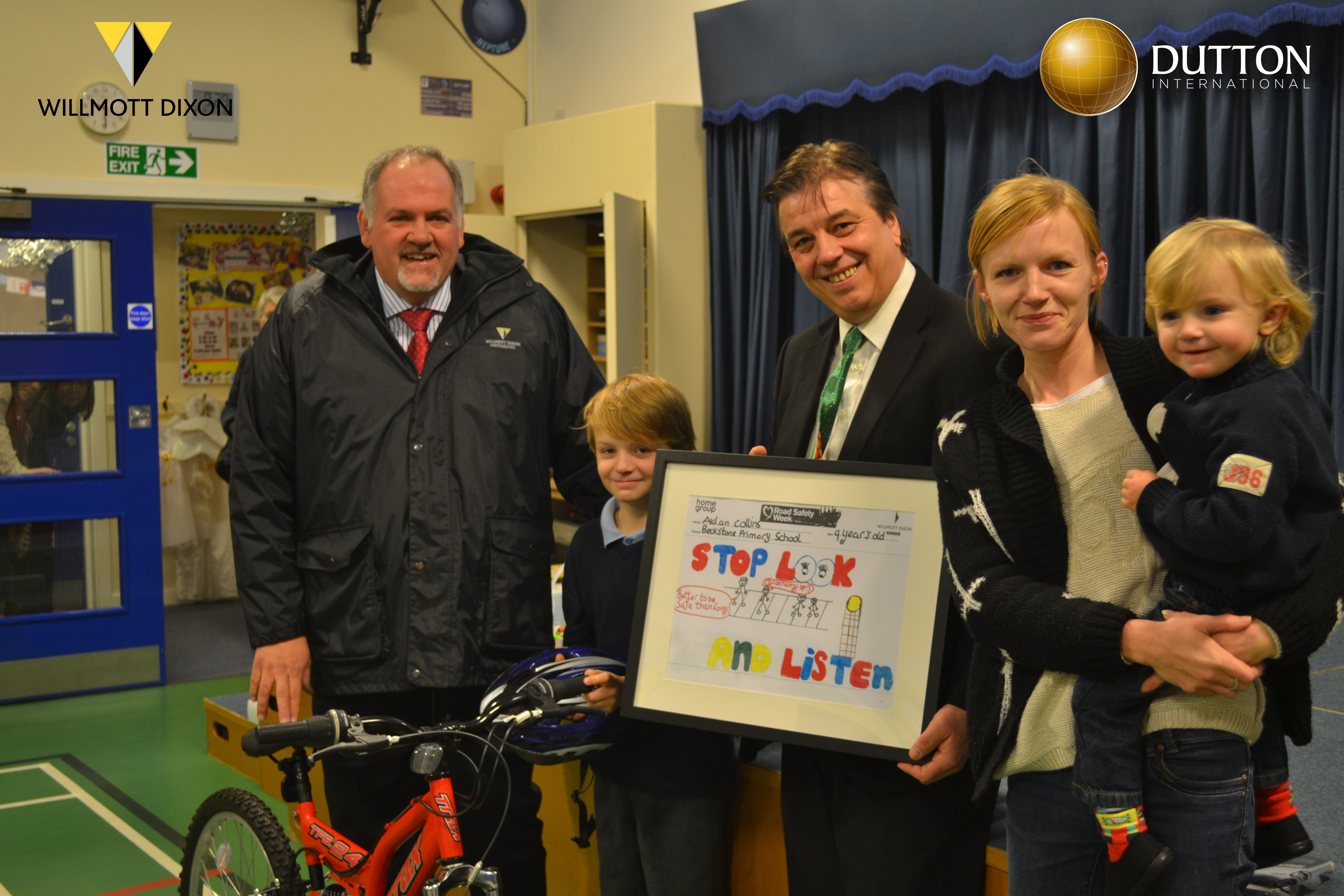 Aiden Collins from Beckstone Primary School, Workington is presented with his winning entry and a brand new bike courtesy of Dutton International